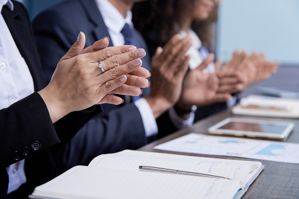 crop-colleagues-clapping-meeting.jpg