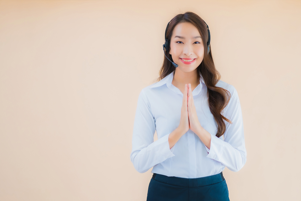 portrait-beautiful-young-asian-business-woman-with-headphone-call-center.jpg